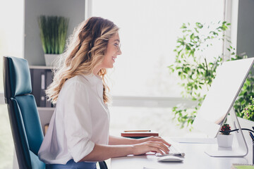 Photo of attractive young woman working manager wear formalwear comfortable modern office sit table...