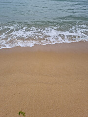 It is a beach with waves crashing in