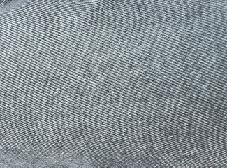 Black and white, grey denim jeans textile for any background. Faded black jeans. Denim fabric. Canvas denim jeans texture. 