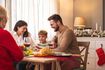 People having family Christmas dinner at home