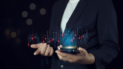 Hand of Businessman or trader is showing a growing virtual hologram stock on smartphone, planning and strategy, Stock market, Business growth, progress or success concept. invest in trading.