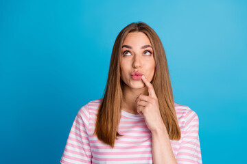 Photo of prety cute lovely woman wear trendy pink clothes look up empty space isolated on blue color background