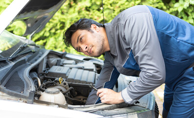 Close-up of auto mechanic fixing the car