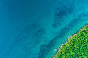 Exotic idyllic sea rocky island turquoise sea bay with green tree forest