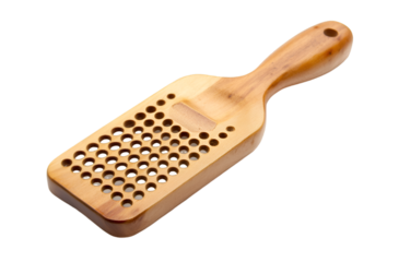 a wooden paddle with holes. 