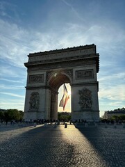 arc de triomphe, arch of triumph in paris france with french flag