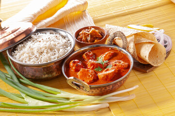 Chicken Tikka with jeera rice with papadum and mango pickle and sliced onion   
