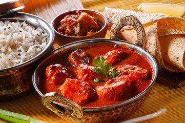 Chicken Tikka with jeera rice with papadum and mango pickle and sliced onion   