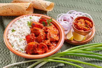 Chicken Tikka with jeera rice with papadum and mango pickle and sliced onion   