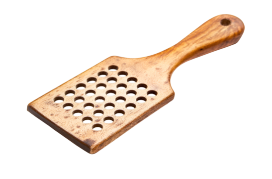 a wooden paddle with holes. 