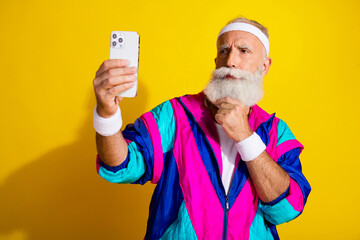 Photo of sportive unsure modern pensioner dressed vintage jacket tacking selfie modern device emtpy...