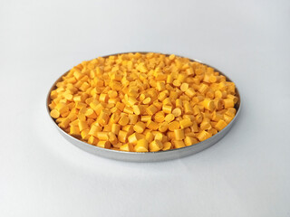 Red masterbatch granule, red polypropylene polymer granules, cold cutting type granule texture, isolated on white background, for industrial plastic company profile product catalog design