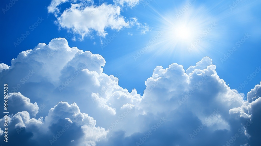 Poster a breathtaking view of fluffy white clouds against a deep blue sky, with sunlight streaming through,
