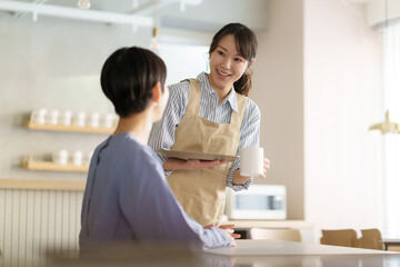 Obraz premium カフェスタッフ