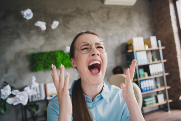 Photo of sad unhappy lady recruiter dressed shirt eyewear screaming indoors workplace workstation...