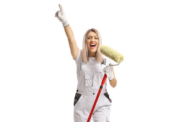 Female painter singing with a paint roller