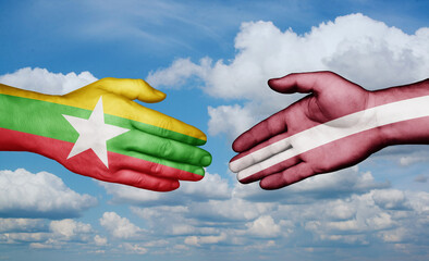 Latvia and Myanmar country handshaking with flags, consensus concept international co-operation illustration