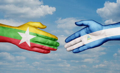 Nicaragua and Myanmar country handshaking with flags, consensus concept international co-operation illustration