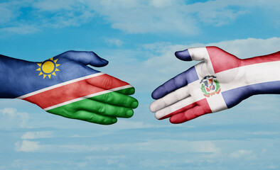 Dominican Republic and Namibia country handshaking with flags, consensus concept international co-operation illustration