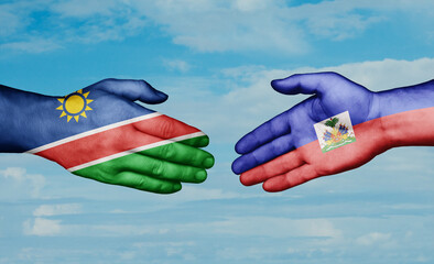 Haiti and Namibia country handshaking with flags, consensus concept international co-operation illustration