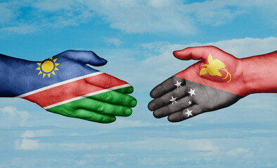 Papua New Guinea and Namibia country handshaking with flags, consensus concept international co-operation illustration