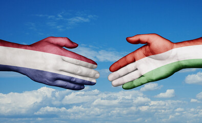 Hungary and Netherlands country handshaking with flags, consensus concept international co-operation illustration