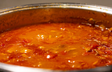 Close-up Homecooking. Making Homemade Bolognese sauce. Making Tomato Sauce. Sauteed mire poix. Cooking Tomatoes. Browning ground beef.