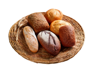 Assorted bread and wheat on a bamboo mat with a transparent background