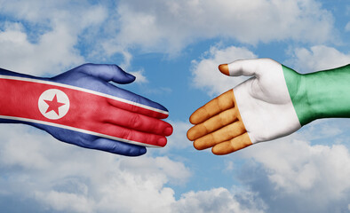 Ivory Coast or Cote d'Ivoire and North Korea country handshaking with flags, consensus concept international co-operation illustration