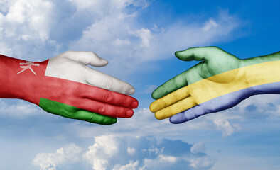 Gabon and Oman country handshaking with flags, consensus concept international co-operation illustration