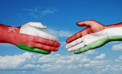 Hungary and Oman country handshaking with flags, consensus concept international co-operation illustration