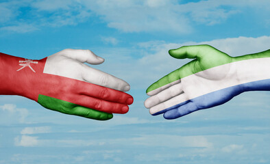 Sierra Leone or Salone and Oman country handshaking with flags, consensus concept international co-operation illustration