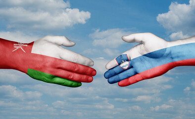 Slovenia and Oman country handshaking with flags, consensus concept international co-operation illustration