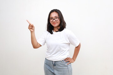 Smiling happy good-looking asian girl giving advice, showing one finger as explain rules, make point, standing white background