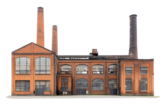 Old brick industrial factory with tall smokestacks and large windows