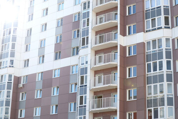 Modern high-rise buildings close-up windows of the house. Multi-storey residential building