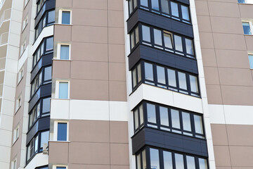 Modern high-rise buildings close-up windows of the house. Multi-storey residential building