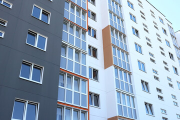 Modern high-rise buildings close-up windows of the house. Multi-storey residential building