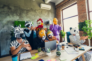 Photo of panda rooster gorilla lion sloth zebra raccoon mask business people desk meeting clapping...