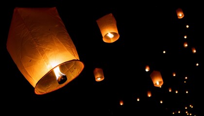 Image of flying lanterns on a black background