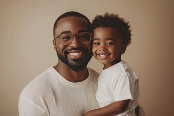 Fototapeta premium Mixed racial Father and cute son smiling and interacting in front of a plain background, dressed in simple clothes, captured in a family photo portrait shoot showcasing their joyful bond