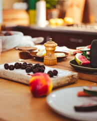 Home kitchen messy breakfast table. Domestic interior family meal preparation.