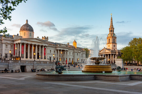 Fountain on Trafalgar square and National Gallery at sunset, London, UK