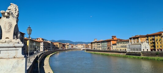 The waterfront of Arno in summer Pisa, Italy. June 27, 2024.