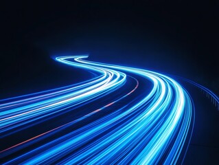 Long exposure photograph of blue neon light trails on a curved path against a dark background, evoking a sense of motion and speed.
