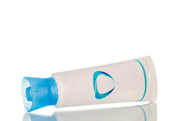 One tube of toothpaste, macro, isolated on white background.