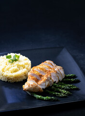 Green asparagus with grilled chicken fillet and couscous