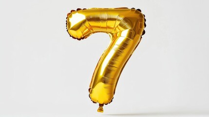 Fototapeta premium A bright golden balloon in the shape of the number seven set against a white background