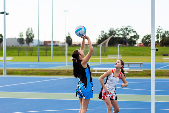 Two Aboriginal sports players training for netball game at the court at Rose Point Singleton