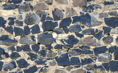 Rock wall seamless texture with grassy stones